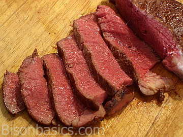 Bison steak sliced and ready to serve.